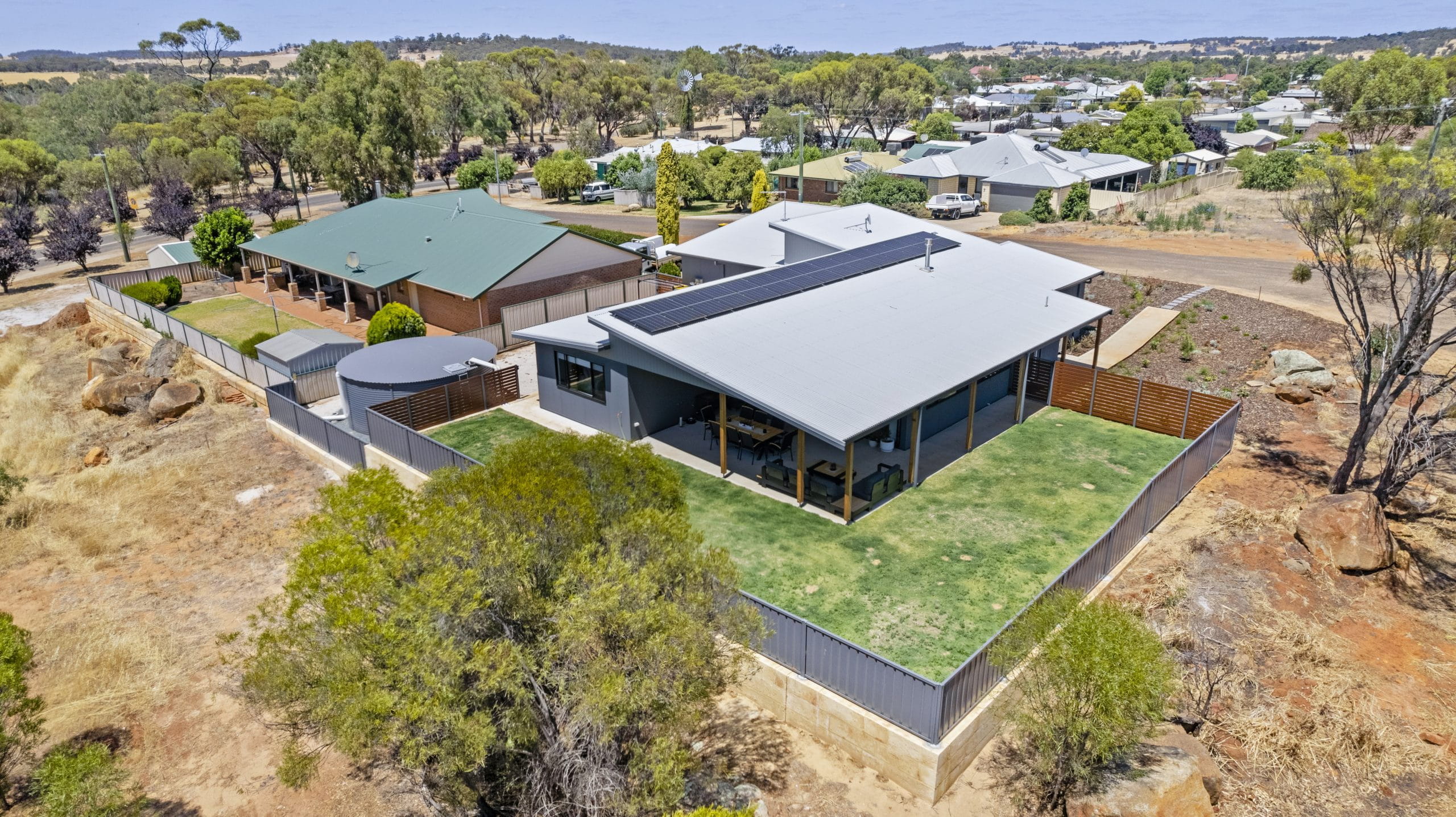 Aerial view of a contemporary single-storey home on a large residential block
